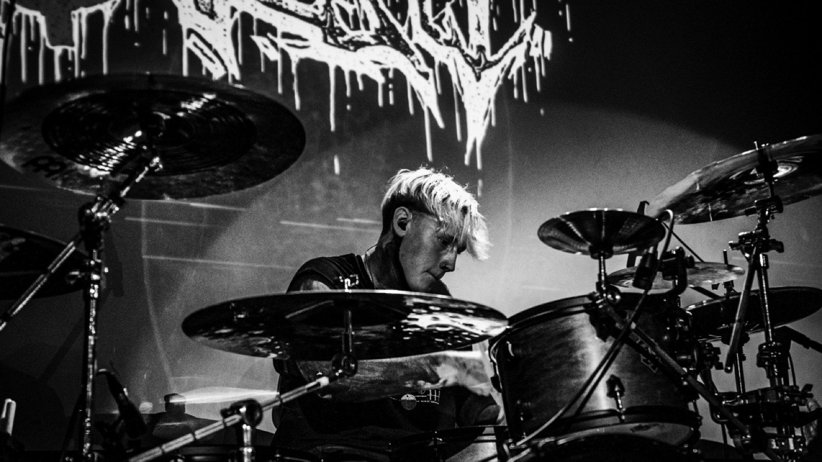 Diggity Glover playing a live set, intense drumming shot